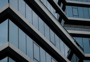 Close-up of a modern office building's tinted glass facade